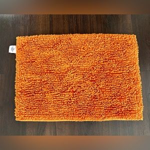 Orange bath mat